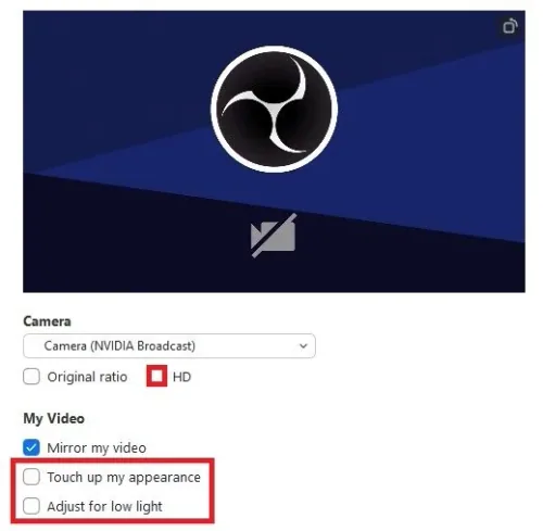 Zoom Video Settings > Touch up my appearance / Adjust for low light